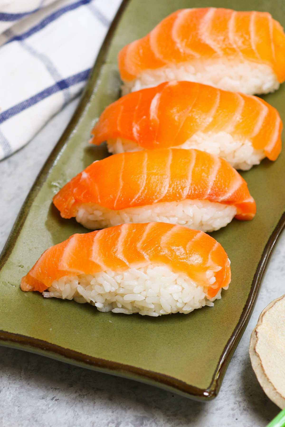 Salmon nigiri sushi with slices of salmon over rice